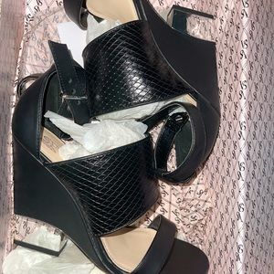 Wedged black and chrome heels with ankle strap